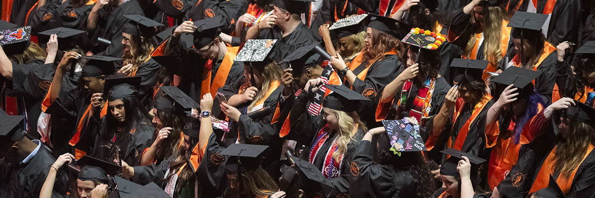 image of graduates turning tassles