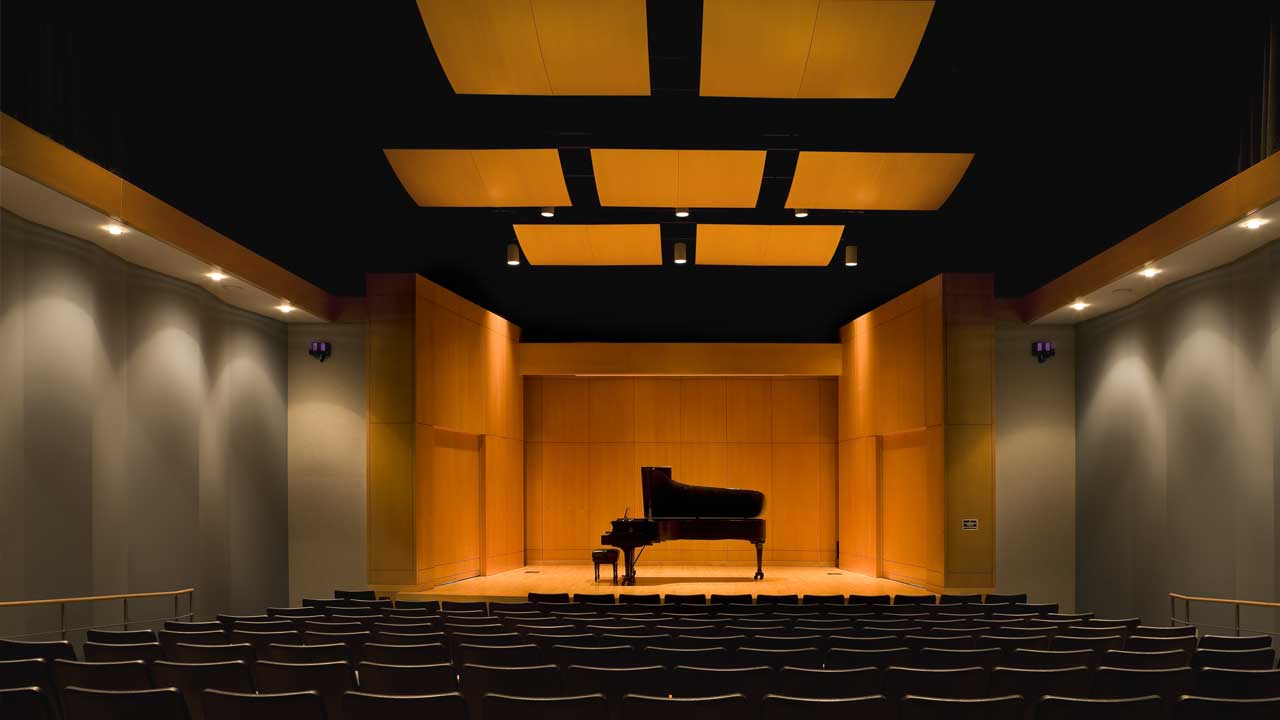 Piano on stage in the SHSU concert hall.