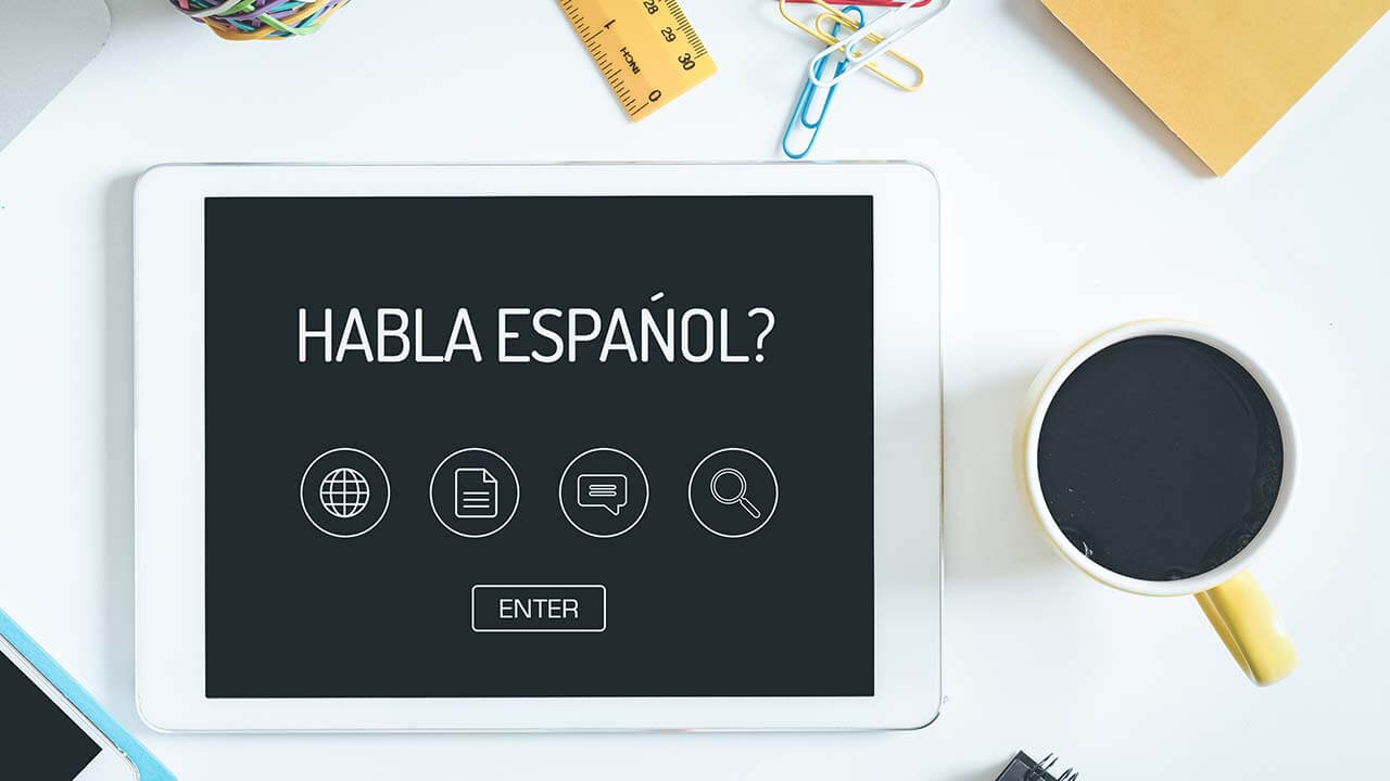 A digital tablet with a Spanish lesson about to begin.