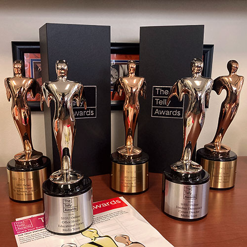 Several telly award trophies