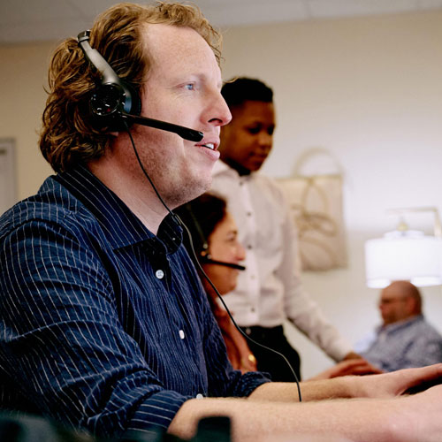 A photo of an SHSU Online employee working in our student call center