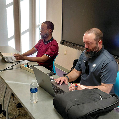 A photo of SHSU Online team members meeting at Sul Ross
