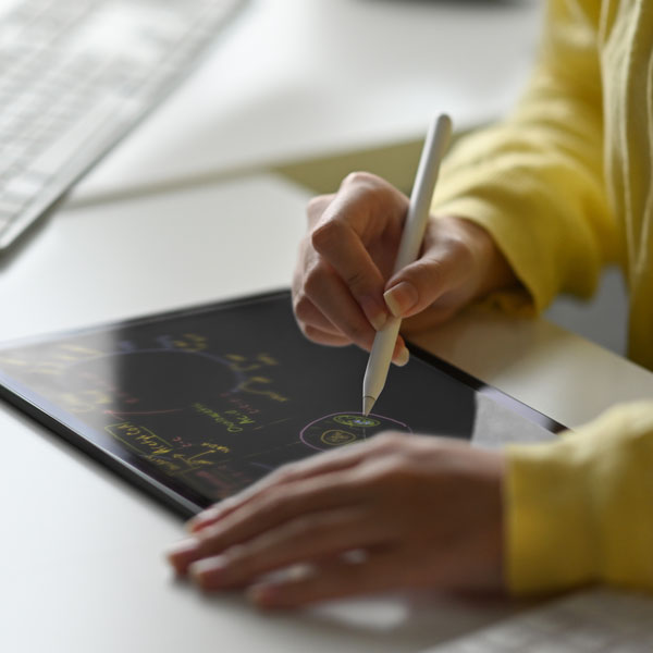 An instructor using a graphics tablet to teach an online class